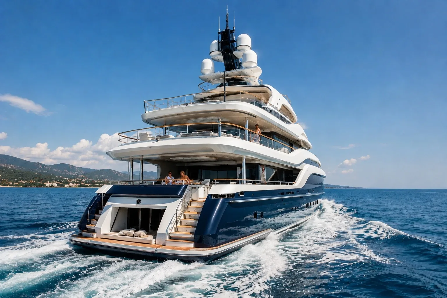 A charter motor yacht underway in open water