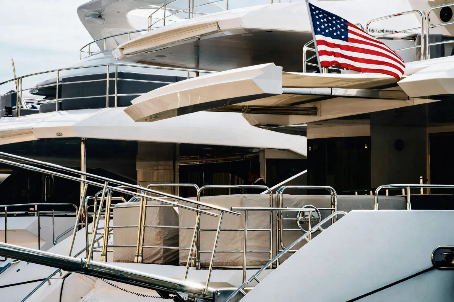 A United States flag flying from a yacht&rsquo;s aft railing